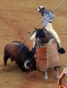 Sevilla - corrida de toros - picador`s action in tercio de varas